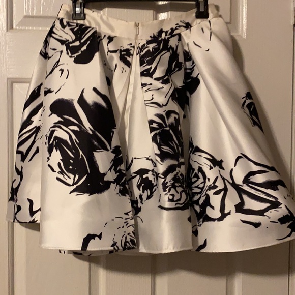 Black and white hoco dress. Worn twice. Bottom is a little dirty not noticeable. - Picture 3 of 4